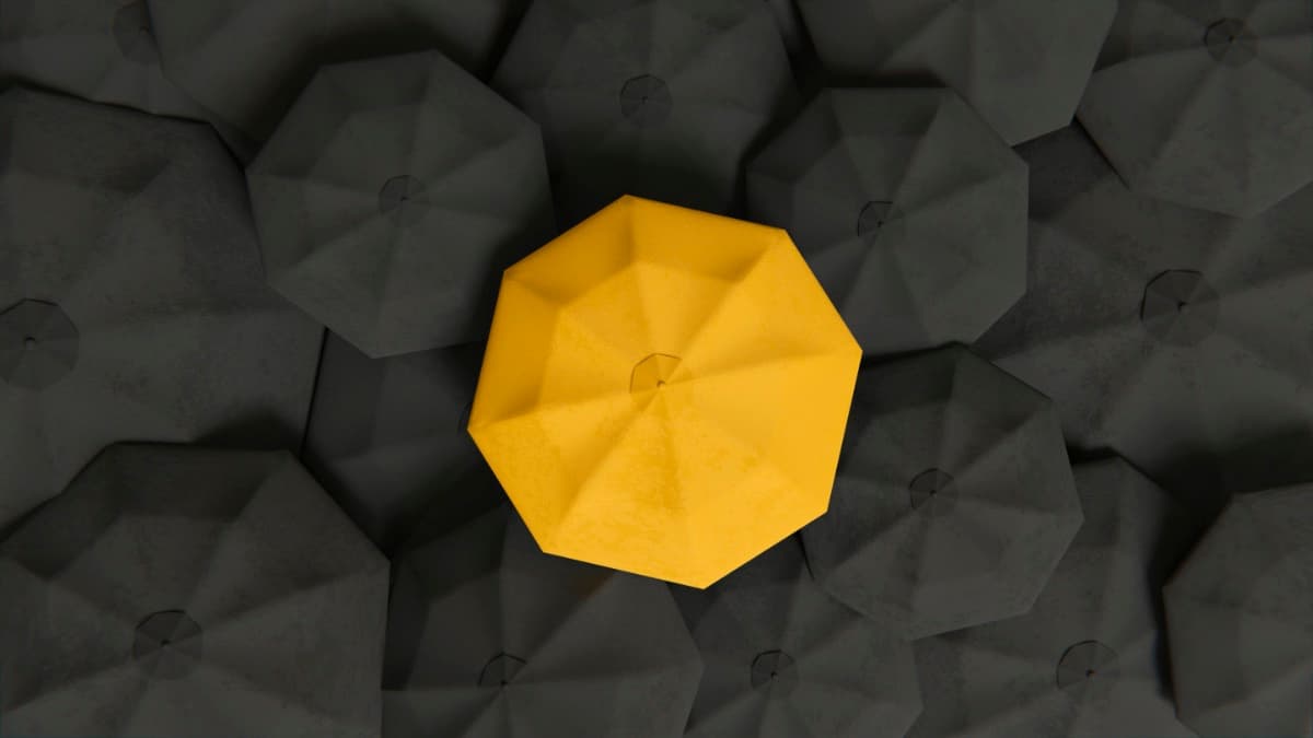 Ein gelber Pavillon hebt sich aus einer Menge grauer Pavillons hervor – Metapher für Arbeitgeber, die aus der Masse herausstechen